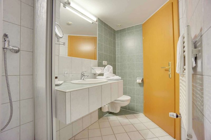 Bathroom with shower and sink in apartment type D