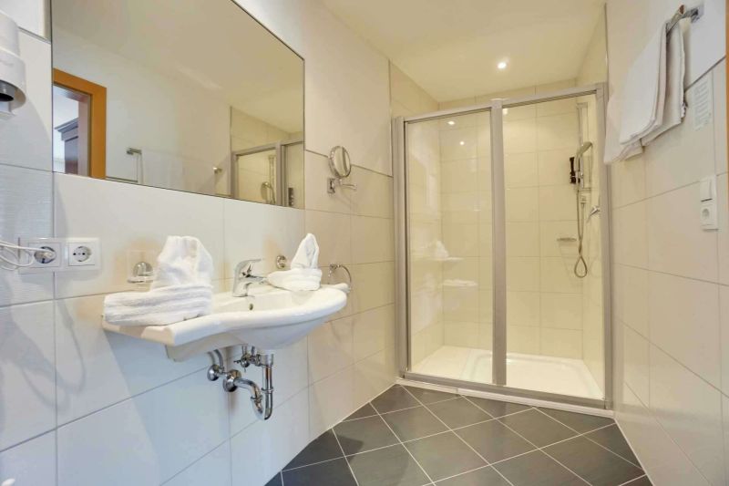 Bathroom with shower and sink in apartment type D