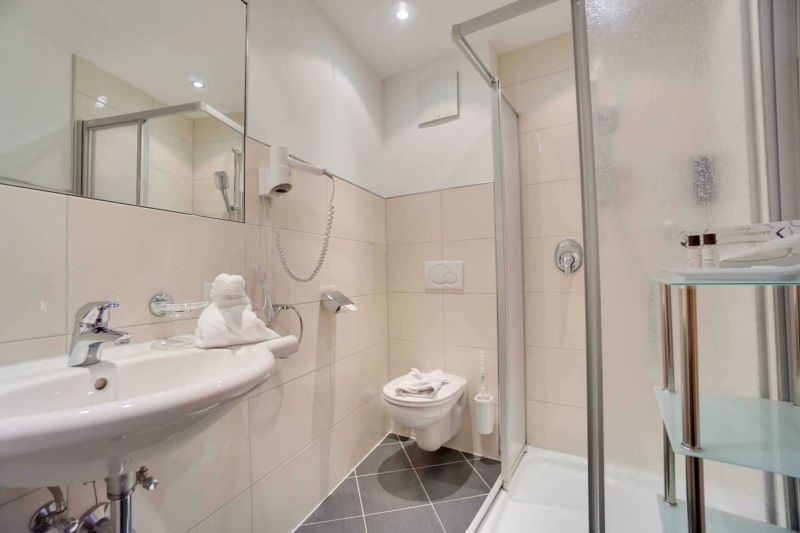 Bathroom with shower and sink in apartment type D