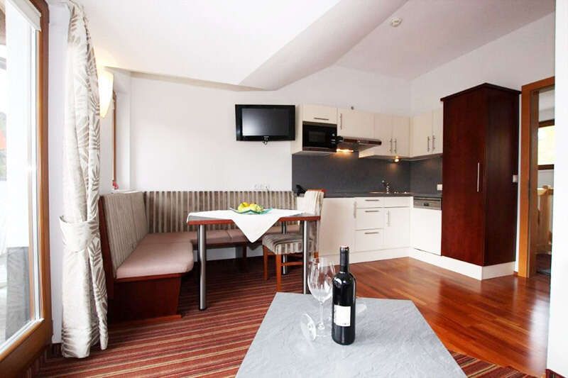 Kitchen-living room with dining area and balcony in Apartment Type I