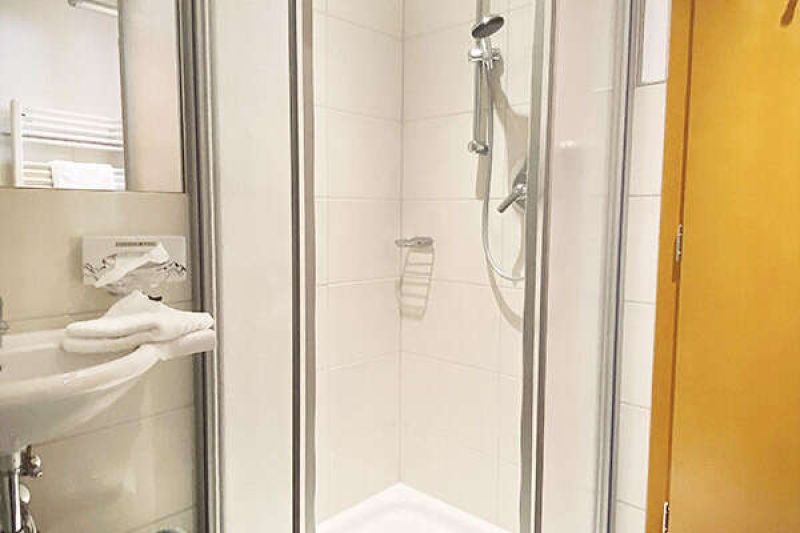 Bathroom with shower and toilet in apartment type B