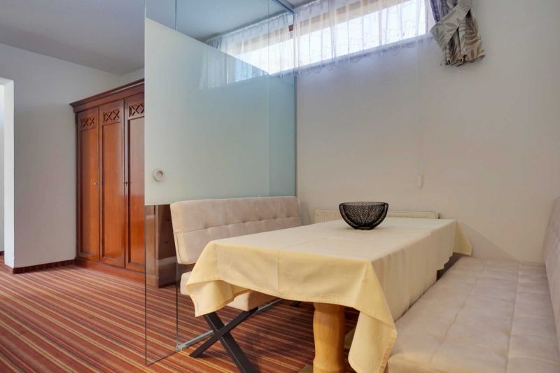 Bedroom with double bed and balcony in Apartment K