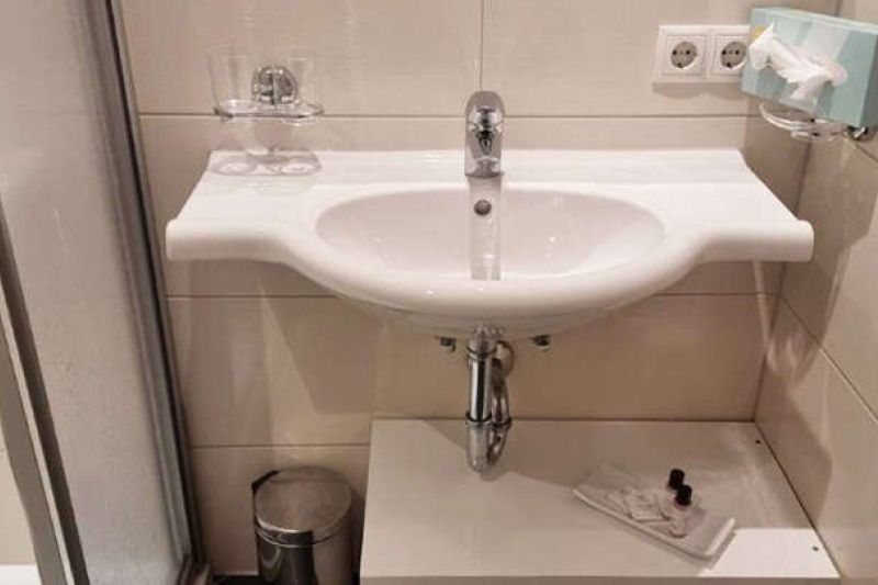Bathroom with shower and sink in Apartment Type I