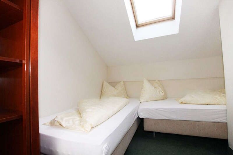 Bedroom with two single beds for children in Apartment C