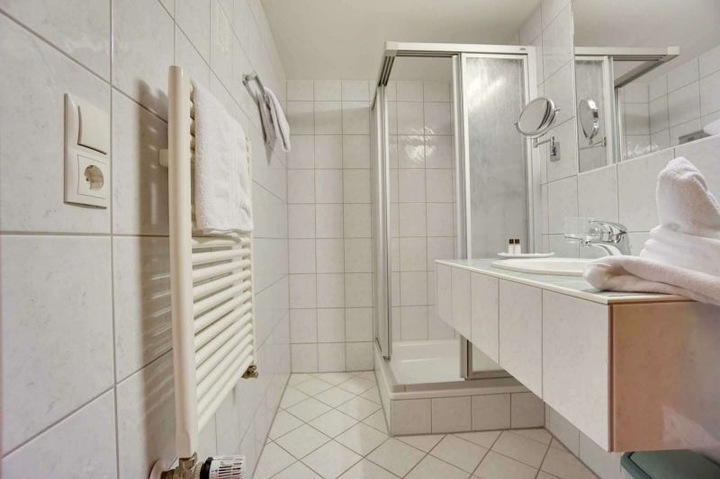 Bathroom with shower and sink in apartment type D