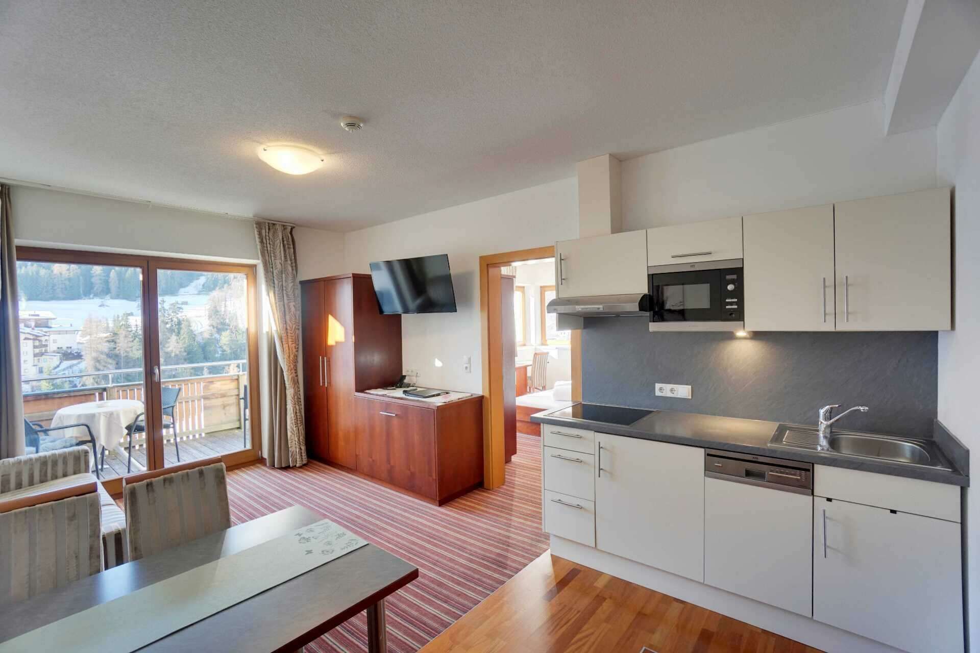 Bedroom with balcony in Apartment Type I in Hotel Philipp