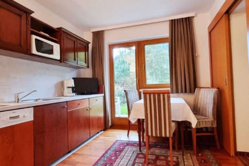 Kitchen with dining area and balcony in Apartment Type L